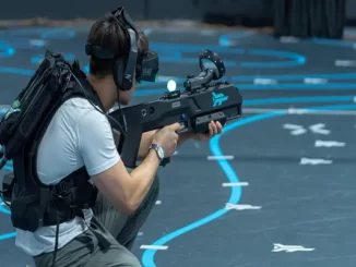 A man with a game gun playing in virtual reality