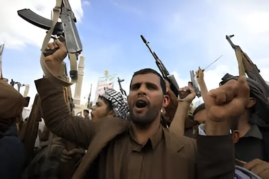 Houthi rebels celebrating with their guns in the air