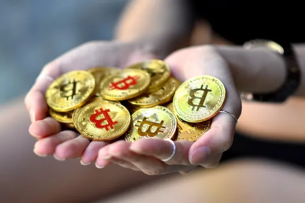 Bitcoin in Hands