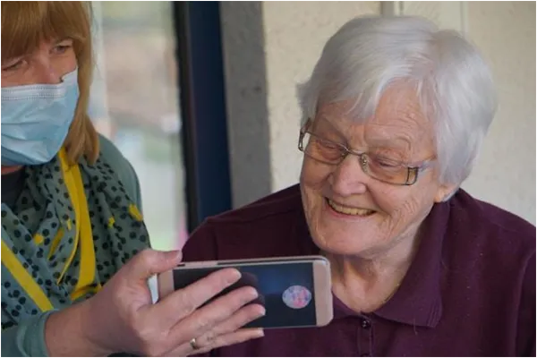 senior woman looking at a phone