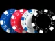A row of four casino poker chips in blue, red, white, and black, featuring dice pips, against a dark background, symbolizing online gambling and betting.