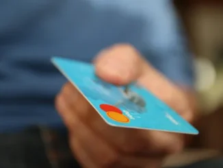 Cryptocurrency coins (Bitcoin, Solana) transforming into a prepaid card, symbolizing fast and cheap purchases in 2025.