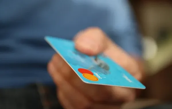 Crypto to Prepaid: Fast & Cheap in 2025 Cryptocurrency coins (Bitcoin, Solana) transforming into a prepaid card, symbolizing fast and cheap purchases in 2025.