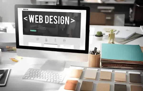 Web Design for a Sustainable Future A computer monitor displaying "WEB DESIGN" with an opening and closing tag, on a desk with design tools and color swatches.