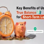 A bright orange alarm clock stands beside a peach-colored piggy bank, both surrounded by scattered stacks of gold coins. A black smartphone to the right displays a pop-up message: "Congratulations! Your loan has been approved." The text "Key Benefits of Using True Balance for Short-Term Loans" is prominently displayed in black, blue, and orange on the right side of the image.