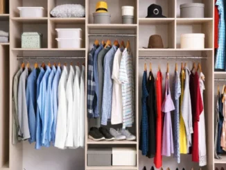 A well-organized wardrobe displaying a mix of smart casual and colorful clothing on hangers and shelves, with hats and storage boxes neatly arranged.