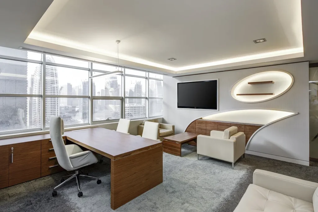 A modern, executive office space with large windows overlooking a city skyline, representing the ideal office environment in Bangalore.