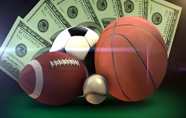 How to Spot a Reliable Wagering Platform with Rapid Transfers A football, soccer ball, basketball, and baseball in front of fanned-out hundred-dollar bills.