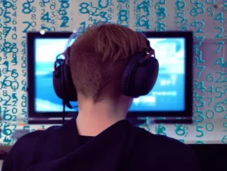 A gamer wearing a headset looks at a screen with numerical data overlaid, symbolizing the technical and detailed nature of optimizing CS2 settings.