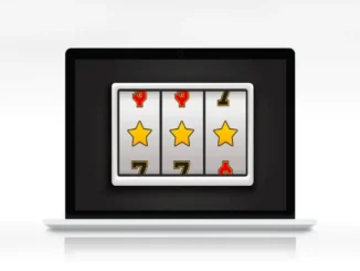 A laptop displaying an online slot machine with three reels showing gold stars, symbolizing online casino gaming and potentially a winning combination.
