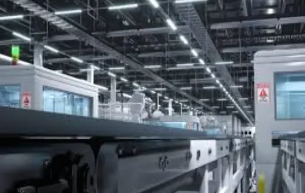 Inside an LED Power Supply Manufacturing Plant Interior of a brightly lit, modern LED power supply factory with automated production lines and machinery.