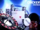 A close-up of a gambling table setup with a roulette wheel, dice, poker chips, and a dealer button, with the "CRICKEX review" logo in the top right corner.