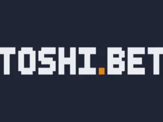 A pixelated logo with white blocky letters spelling "TOSHI.BET" on a dark background, with a small orange square replacing the dot on the "i".