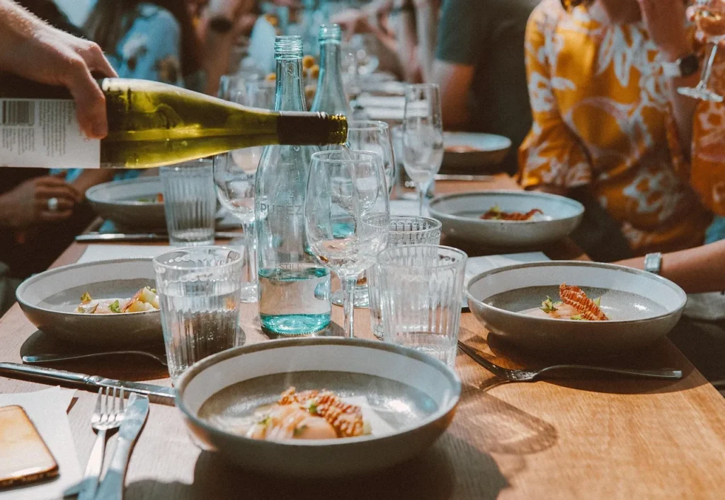 elegant dinner party wine pour