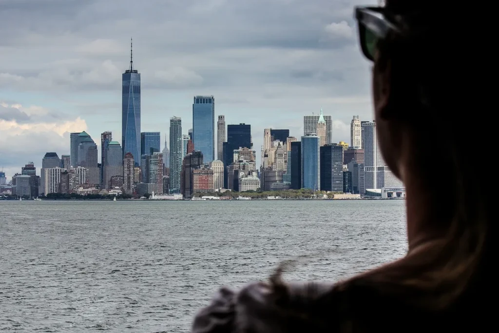 Person looking at New York City, hoping to regain control on the road to recovery.