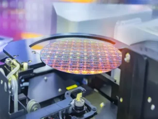 A high-tech cleanroom at the Rapidus IIM-1 foundry in Hokkaido, featuring robotic arms handling a 300mm silicon wafer for 2nm chip manufacturing.