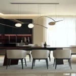 A modern luxury dining room featuring white sculptural chairs with curved silhouettes, a dark minimalist table, and a futuristic organic pendant light against a backdrop of dark kitchen cabinetry.