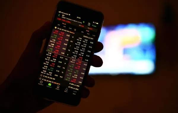 A professional mobile trading app interface showing real-time stock charts, technical indicators, and option chain data for intraday trading in India.
