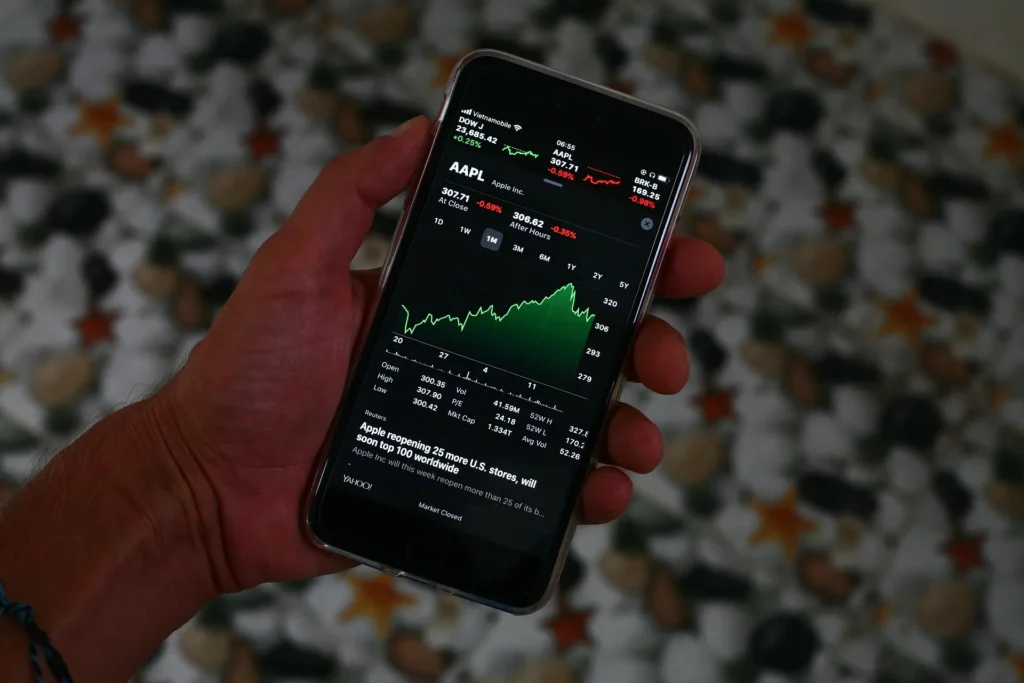 Mobile stock market app displaying real-time intraday stock chart and price movement on smartphone