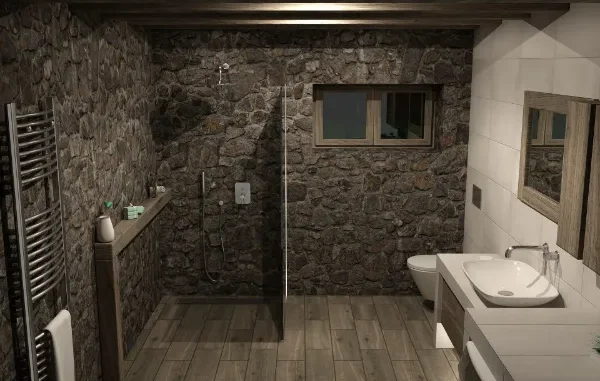 A sleek, floor-to-ceiling custom glass shower partition in a rustic bathroom with stone walls and wood-plank flooring.