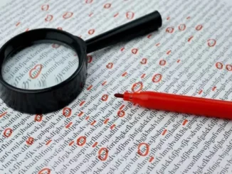 A magnifying glass and a red marker laying on a page of jumbled text with several characters circled in red to represent a manual editing or plagiarism checking process.