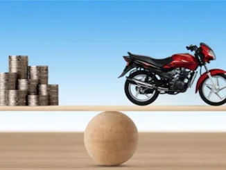 A conceptual image showing a stack of silver coins on one side of a balance scale and a red motorcycle on the other, representing the financial balance of a bike loan.