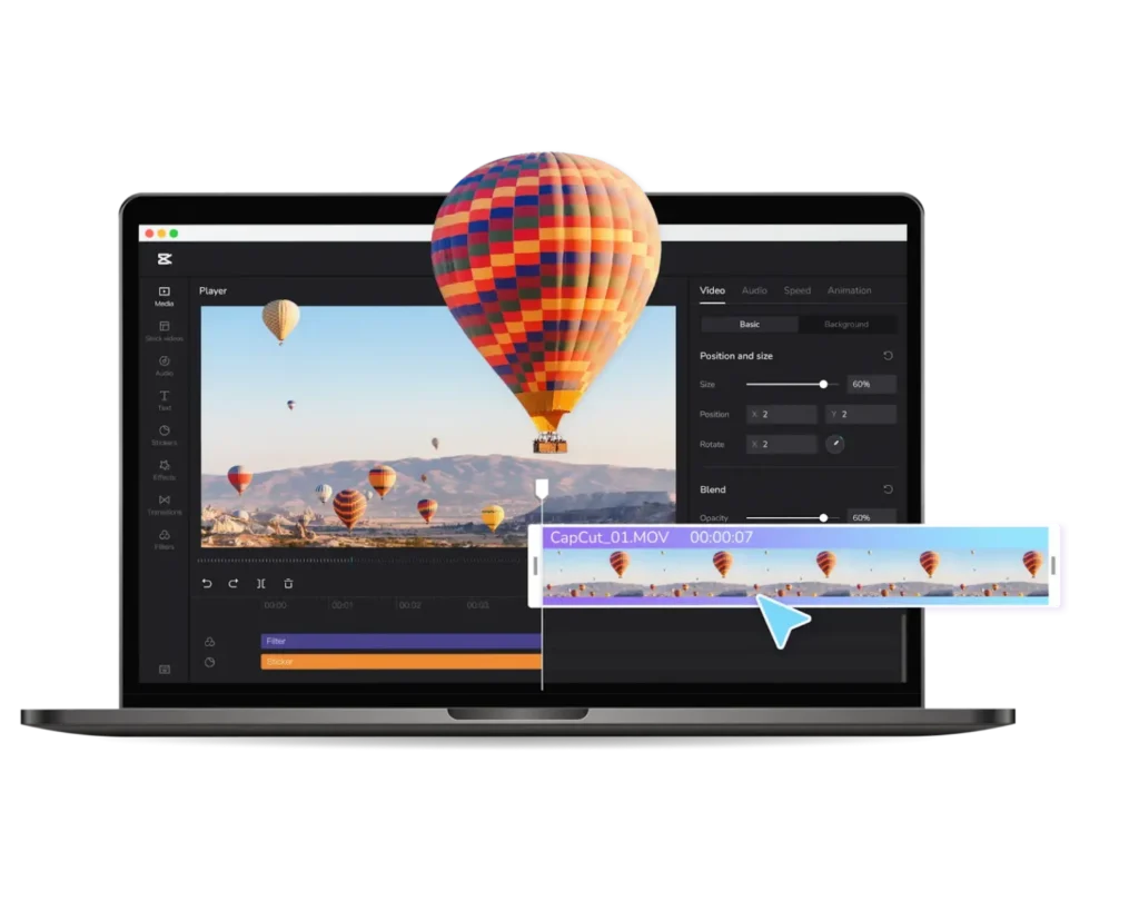 A laptop screen displaying the CapCut desktop video editing interface. A colorful hot air balloon appears to pop out of the screen in a 3D effect. The interface shows a video timeline with a clip titled "CapCut_01.MOV," editing tools for position and size, and a preview window of a desert landscape filled with hot air balloons.