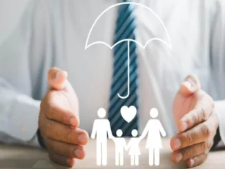 A conceptual image showing a person’s hands shielding a family icon under an umbrella, representing protection and medical insurance coverage.