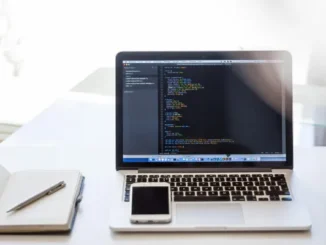 A close-up of a laptop on a wooden desk in a bright, modern office setting, representing a professional upskilling in Generative AI for 2026.