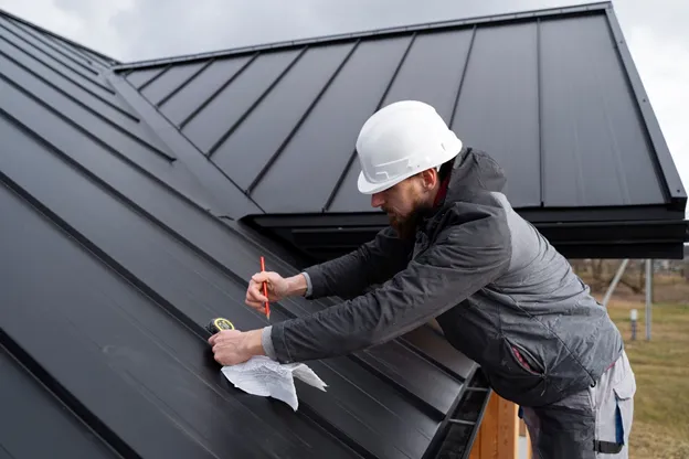A certified roofing contractor inspecting a residential roof with safety gear in Westminster, Maryland.