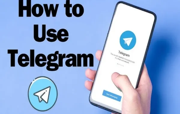 A hand holding a smartphone displaying the Telegram welcome screen with the blue paper plane logo and "Start Messaging" button against a blue background.