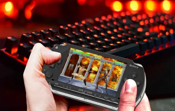 Close-up of a person holding a Sony PSP handheld console displaying a 2D fighting game, with a glowing red mechanical gaming keyboard in the blurred background.