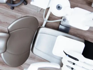 High-angle view of a modern, clean aesthetic clinic treatment chair and medical equipment in a luxury US clinic.
