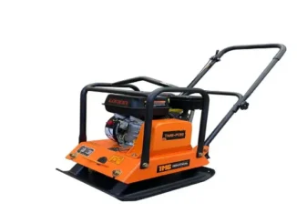 An orange and black TMG Industrial vibratory plate compactor with a Loncin engine, designed for soil and gravel ground preparation in industrial construction.