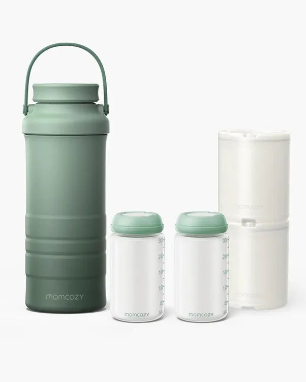 Momcozy compact breast milk cooler set featuring a tall, sage green insulated travel thermos with a handle, two clear breast milk storage bottles with green lids, and a stack of two white ice packs against a plain white background.