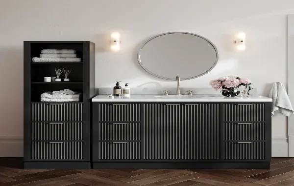 Modern matte black fluted ARIEL Bath vanity and matching linen cabinet with a white marble countertop in a moisture-resistant bathroom setup.