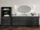Modern matte black fluted ARIEL Bath vanity and matching linen cabinet with a white marble countertop in a moisture-resistant bathroom setup.
