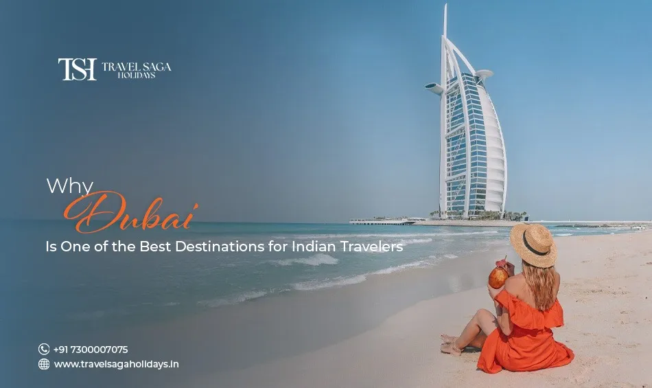 A traveler sitting on a sunny beach in Dubai holding a drink with the iconic Burj Al Arab hotel in the background.