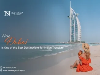 A woman in an orange dress and straw hat sipping a coconut on a sandy Dubai beach with the iconic sail-shaped Burj Al Arab hotel in the background.