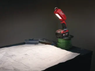 A side-by-side product view of the SurfPrep LED inspection light bar in red casing, shown both turned off to display the bulb array and illuminated to demonstrate its bright raking light beam pattern.