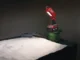 A side-by-side product view of the SurfPrep LED inspection light bar in red casing, shown both turned off to display the bulb array and illuminated to demonstrate its bright raking light beam pattern.