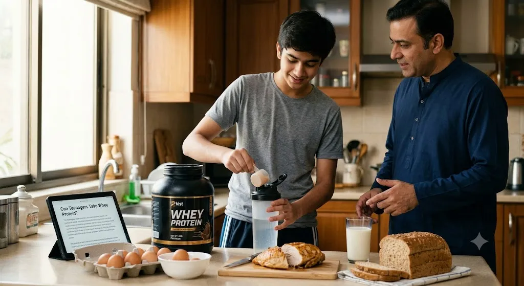 A teenage boy scooping whey protein powder into a shaker bottle in a kitchen while his father stands beside him giving guidance, with whole foods like eggs, milk, and chicken breast on the counter.