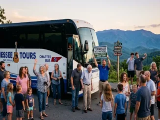 A large group of people stand smiling and posing next to a 'Tennessee Tours' charter bus at a scenic overlook with rolling mountains in the background, a wooden signpost pointing to popular Tennessee cities, and one man holding a sign promoting 'Tennessee Destinations: Family, Friends & Group Tours.'