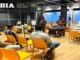 A group of students in an interactive classroom setting at Boston Institute of Analytics in Hyderabad, where one student is presenting to the class while others listen and take notes, symbolizing practical training and placement preparation.