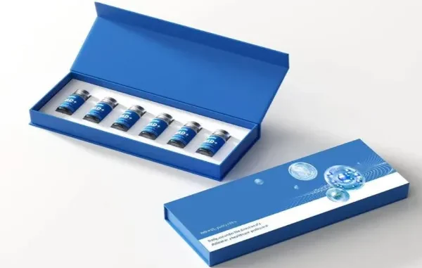 A professional-grade, custom blue magnetic-closure rigid box set for peptide vials, showing six small glass vials neatly arranged in a precision-cut white foam insert, with the matching branded outer box displaying technical graphics of molecular structures and text.