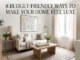 Bright, elegant neutral living room featuring floor-to-ceiling drapes, a beige sofa with throw pillows, large framed wall art, and warm wooden furniture, overlaid with text reading "8 Budget-Friendly Ways To Make Your Home Feel Luxe."
