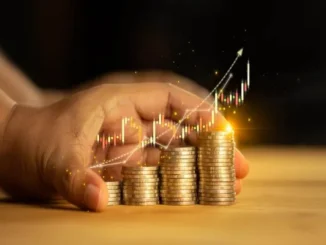 Hands safeguarding stacks of coins with a glowing upward financial chart, illustrating smart budgeting strategies for Dhanteras gold purchases.