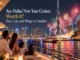 A family sitting on a boat deck watching fireworks light up the sky around the Burj Khalifa and the illuminated Dubai skyline at night.