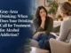 A woman sitting thoughtfully on a couch during a therapy session with a counselor to discuss gray-area drinking and alcohol treatment options.
